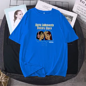 Close-up of bright blue cotton t-shirt featuring artistic female character prints