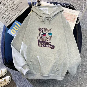 Oversize light gray hoodie with 3D tiger print and kangaroo pocket in a flat lay setup