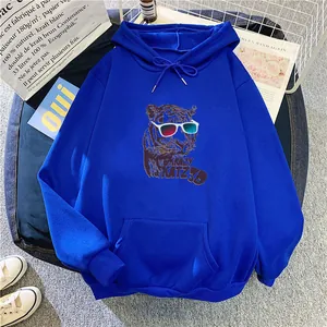 Close-up of blue oversized hoodie featuring a 3D tiger print with kangaroo pocket detail