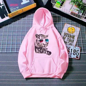 Detail of pink oversized hoodie showing trendy 3D tiger print and kangaroo pocket
