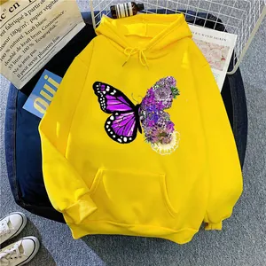 Flat lay of bright yellow hoodie with artistic floral butterfly print and front pocket
