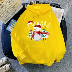 Detail of yellow Christmas hoodie with snowman print and Believe lettering decoration