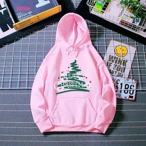 Detail of pink Christmas hoodie with green tree graphic and Merry Christmas lettering