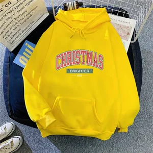 Bright yellow fleece-lined Christmas hoodie for women in a stylish flat lay arrangement