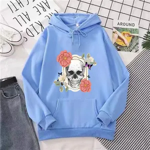 Sky blue oversized hoodie with skull and floral print, casual aesthetic outfit