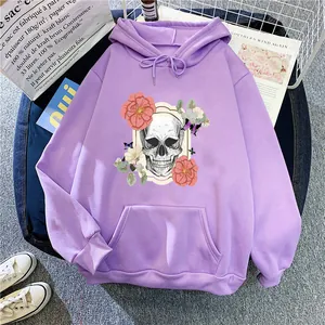 Detail of lavender fleece hoodie featuring gothic skull and pink floral art print
