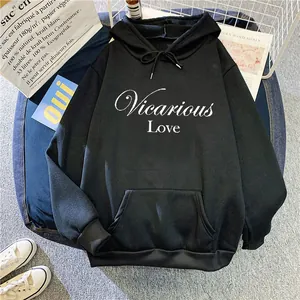 Flat lay of black hoodie with Vicarious Love print and kangaroo pocket detail