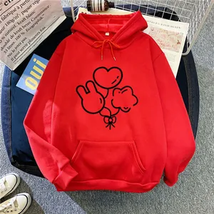 Detail of red hoodie with black line balloon graphics and large kangaroo pocket front