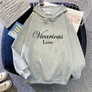 Detail showing printed Vicarious Love lettering and kangaroo pocket on gray hoodie