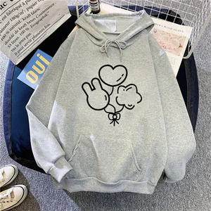 Detailed view of light grey hoodie with cartoon balloon print on cozy fabric