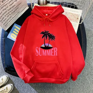 Detail of red oversized hoodie featuring summer coconut tree print and front kangaroo pocket