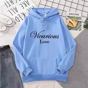 Detail of light blue hoodie with Vicarious Love print and kangaroo pocket