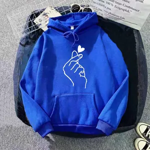 Detail of royal blue hoodie showing white finger heart print and soft knit texture