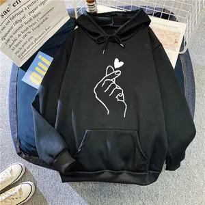 Oversized black fleece hoodie with white finger heart graphic and drawstring hood