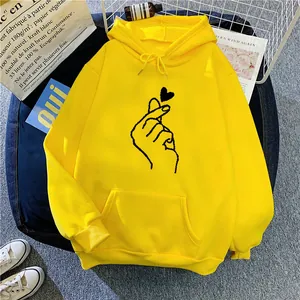 Oversized bright yellow drawstring hoodie with hand heart graphic and front pocket