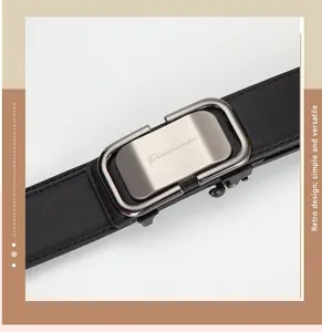 Detail of men's black leather belt with silver brushed automatic buckle and fine stitching