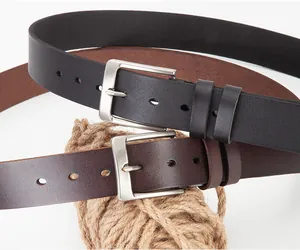Detail view of classic leather belts with brushed silver buckles in black and brown