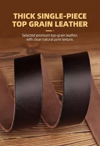 Detailed macro view of dark brown genuine first layer cowhide leather strap on wood