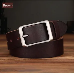 Detail of coffee brown leather belt with matte rectangle metal pin buckle on wood