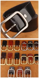 Macro view of black leather belt texture with various vintage metal pin buckles