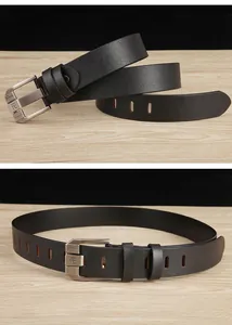 Detail of classic black leather belt with metal pin buckle on wood background