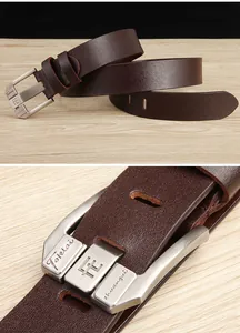 Detail of genuine brown leather belt with brushed silver alloy buckle on wooden background
