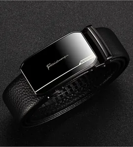 Macro view of men's leather belt showing lychee grain texture and metal buckle detail