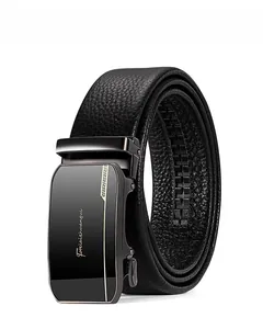 Detail view of black lychee grain leather belt with gunmetal automatic buckle and gold accents