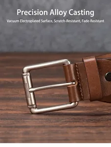 Detail of a brown leather belt with a brushed alloy pin buckle on a dark wood background