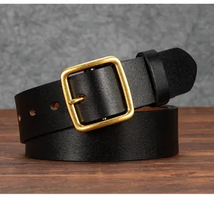 Close-up of vintage black leather belt featuring a rustic brass square pin buckle