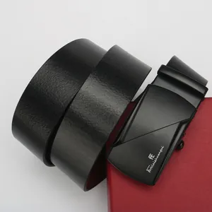 Macro detail of men's black leather automatic belt with premium matte buckle and gift box