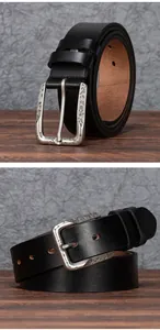 Detailed close-up of retro engraved alloy buckle on a black premium cowhide leather belt