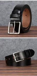 Detail of genuine leather belt with silver square pin buckle and textured metal frame