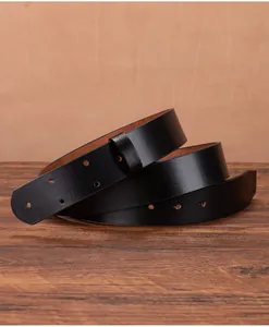 Detail of 3.5cm wide black genuine cowhide leather belt strap with holes and smooth texture