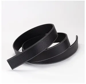 Detail of black leather belt with lychee texture and contrast white stitching