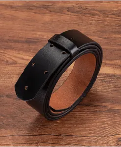 Detail of genuine black leather belt with double-row holes on wooden background