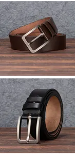 Detail of vintage men's leather belts with brushed metal buckles in black and brown