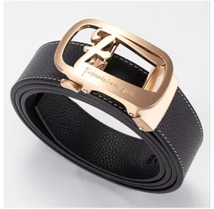 Detail of black pebbled leather belt with contrast white stitching and gold auto buckle