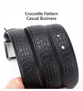 Close-up of black leather belt with crocodile pattern and classic metal buckle detail