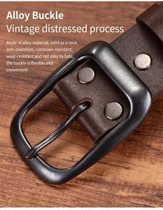 Macro shot of vintage dark brown leather belt with antique alloy pin buckle details
