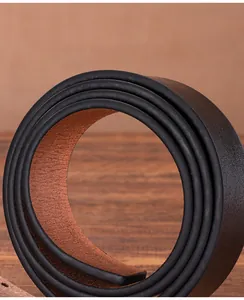 Macro shot of rolled vintage genuine cowhide leather belt showing thick texture and dual colors