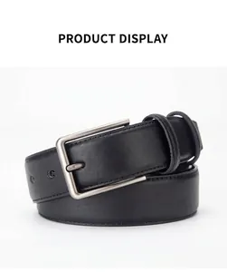 Macro detail of men's black leather belt featuring textured finish and frosted metal buckle