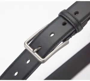 Macro shot of men's black leather belt featuring silver pin buckle and textured finish