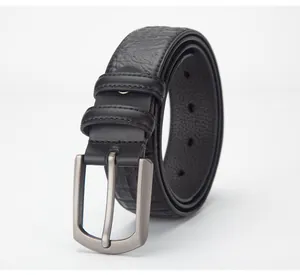 Detail of black leather belt with lychee texture and brushed metal square pin buckle
