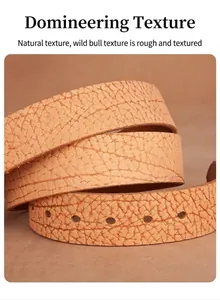 Close-up of natural brown leather belt showing thick bison grain texture and punched holes