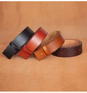 Macro view of four leather belt straps in black, reddish-brown, tan, and dark coffee