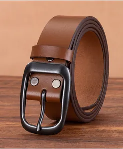 Detail of vintage brown leather belt showing sturdy matte black buckle and fine stitching