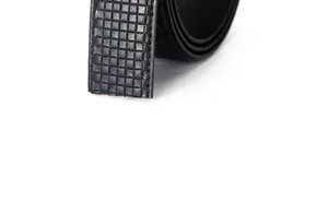 Detail of men's black leather belt featuring grid embossing and neat side stitching
