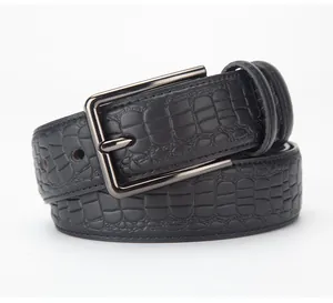 Close-up of black crocodile-embossed leather belt with a gunmetal pin buckle for men