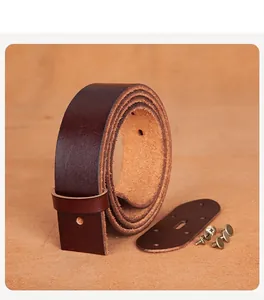 Detailed view of dark brown cowhide leather belt DIY parts with vintage gold screws